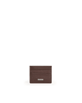 A dark brown textured leather card holder wallet with a small silver metal brand plaque, centered on a solid white background.