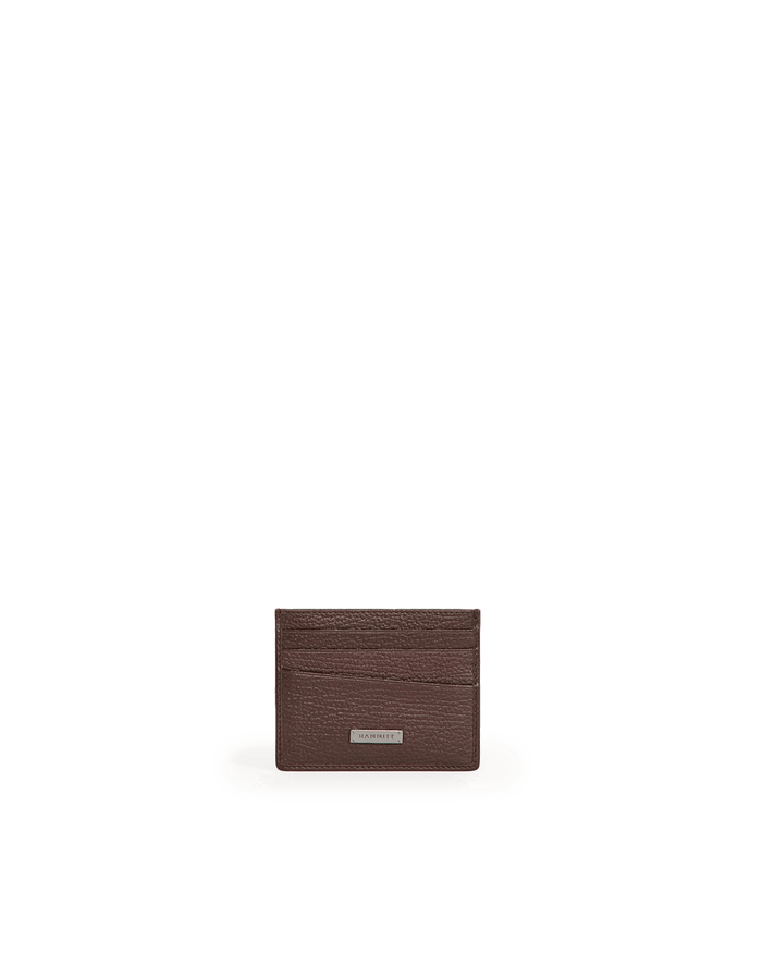 A dark brown textured leather card holder wallet with a small silver metal brand plaque, centered on a solid white background.