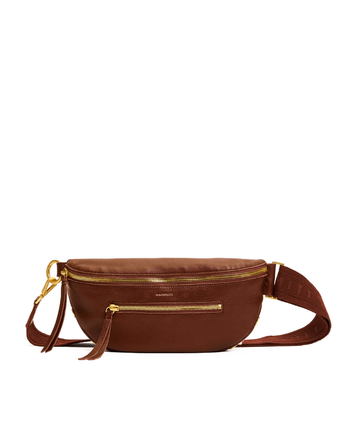 Brown leather waist bag with gold zipper on a white background