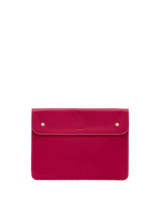 Pink leather clutch bag with gold hardware on a white background