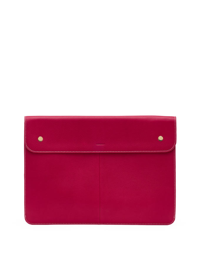 Red leather clutch bag with gold hardware on a white background