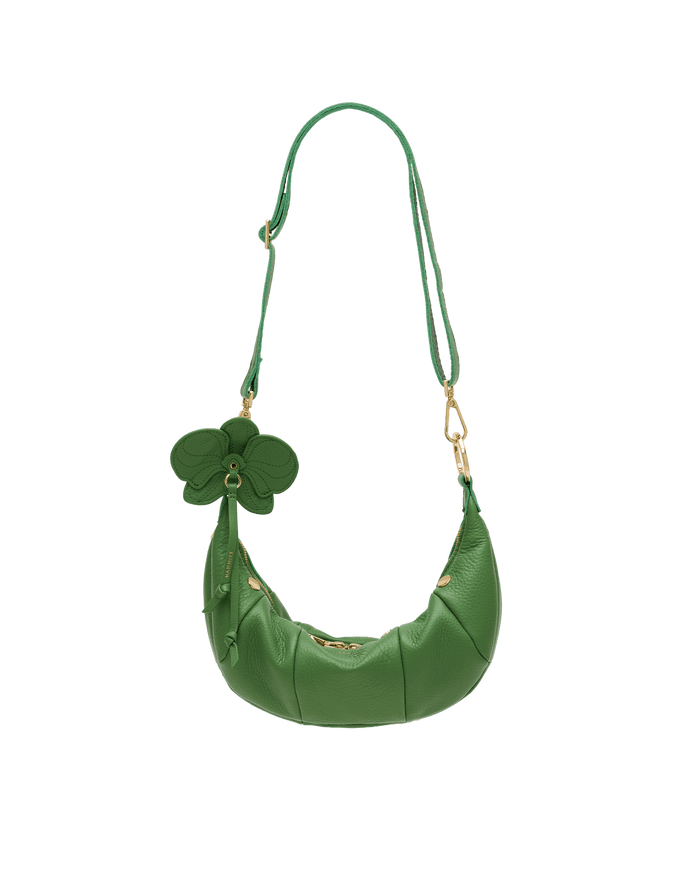 Green handbag with floral details on a black background