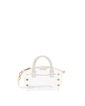 A clear acrylic handbag with white faux-leather trim, gold-tone hardware, and a white top handle.