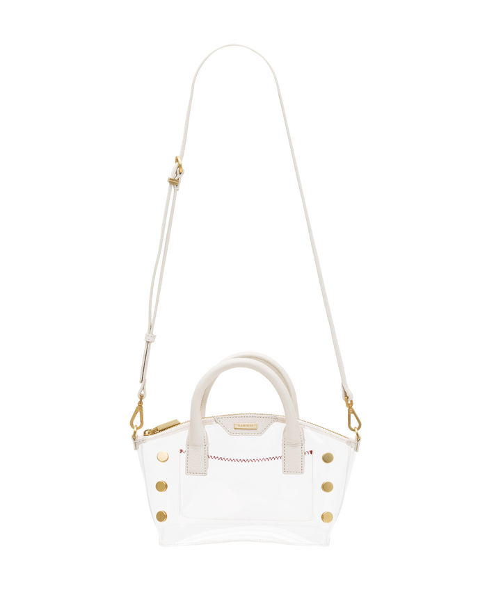 A clear vinyl handbag with white leather trim, gold-tone hardware, a top handle, and a long adjustable shoulder strap.