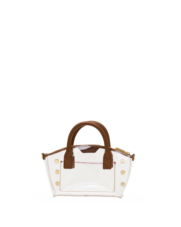 A clear acrylic handbag with brown faux-leather handles and trim, accented by gold-tone studs .