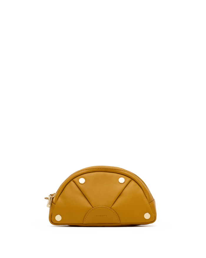 Brown leather pouch with gold zipper on a white platform against a black background