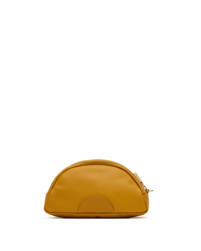 Mustard yellow leather pouch on a white platform with a black background
