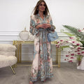 Vestido elegante con escote en pico, cintura alta, estampado floral y botones.-ES