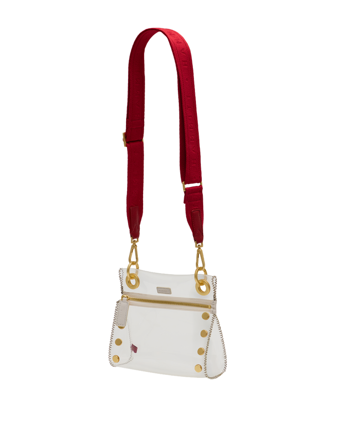 White handbag with gold accents and a red strap on a white background