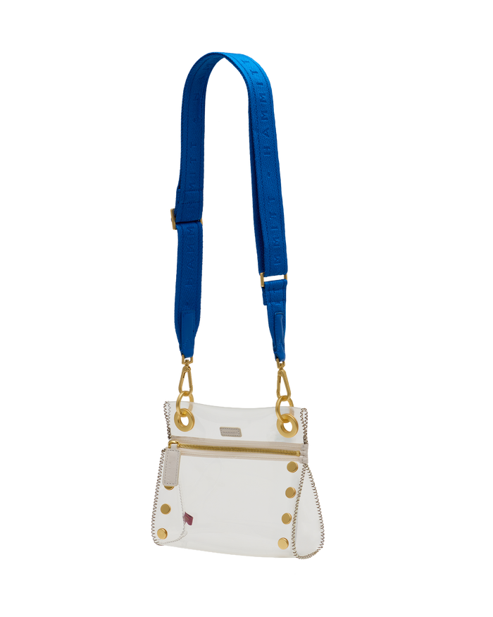 White handbag with gold accents and a blue strap on a white background